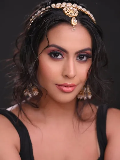 A direct portrait showing the beautiful blend of the eye makeup.