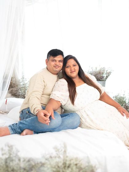 A relaxed portrait of a couple in a casual studio setting. My goal is to make you feel comfortable, as if you were just relaxing at home.