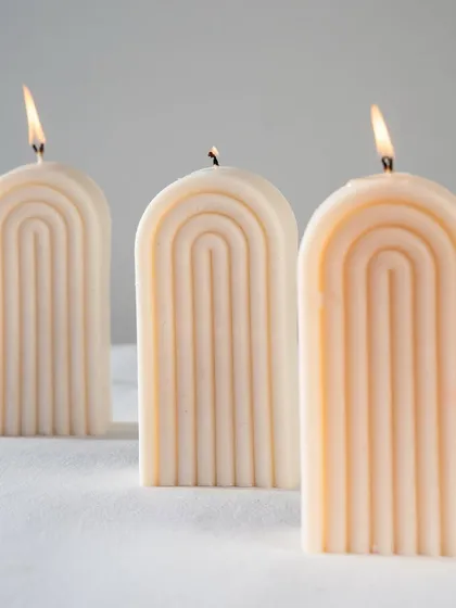 A trio of our arch or rainbow candles. Their minimalist, geometric shape makes them a perfect addition to any modern interior.