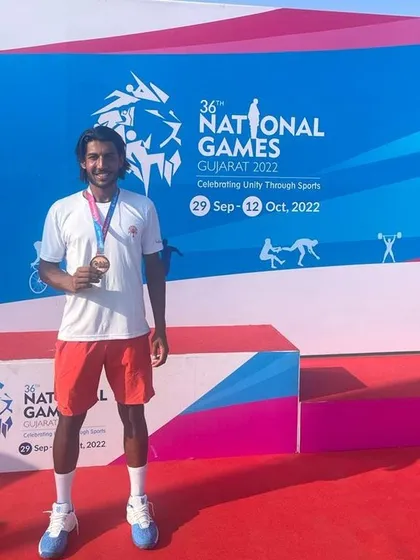 Sarthak Suden on the podium with his Bronze Medal at the 36th National Games.