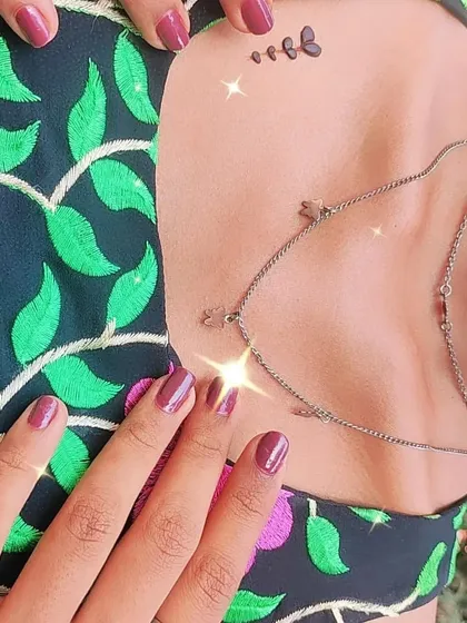 A tiny, subtle butterfly tattoo on the collarbone, the ultimate minimalist statement.