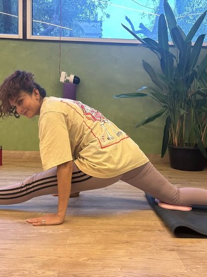 Another student using sliders to progress in her splits training. Consistency and patience are key, and we're here to guide you.