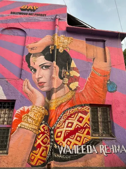 A vibrant mural of Waheeda Rehman from the Bollywood Art Project in Bandra. I document Mumbai's famous street art, which celebrates the city's cinematic history.