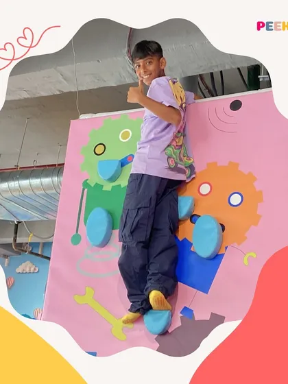 Thumbs up from the top. This young climber is proud of his achievement, and we love seeing their happy, triumphant faces.