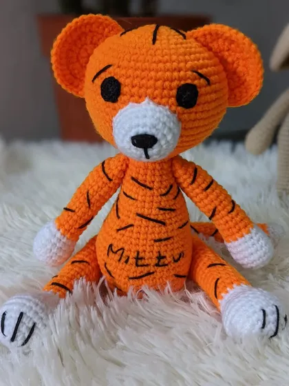 A custom tiger doll named 'Mittu', with embroidered stripes.