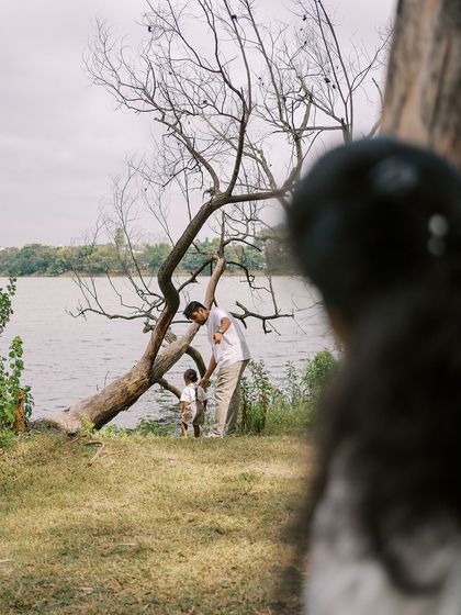 A father and son by the lake. A quiet, contemplative moment that shows a different side of their bond.