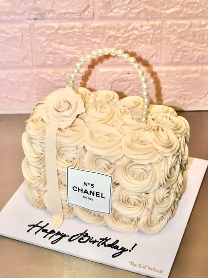 For the fashion lover, we sculpted this iconic Chanel handbag entirely from cake. Covered in buttercream rosettes and finished with an edible pearl handle, it’s a slice of luxury that tastes as good as it looks.