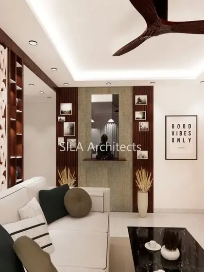 Another perspective of the JP Nagar residence, this time showcasing a wall with floral wallpaper that adds a touch of softness and artistry to the modern living space.