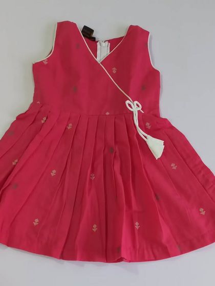 The Abhirami set is a two-piece outfit in a lovely pink. The angrakha style top is made of pure, soft cotton with a lining, and the ankle-length pants prevent tripping, making it safe and comfortable.