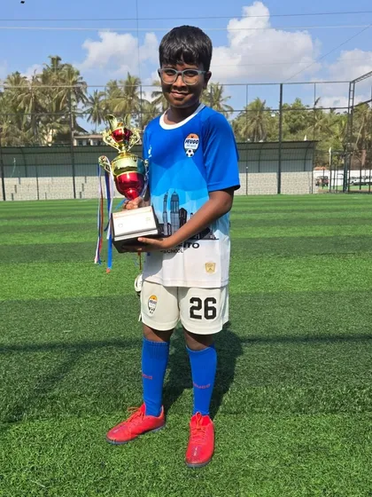 Another U12 champion with his well-earned trophy after the Goa tournament.