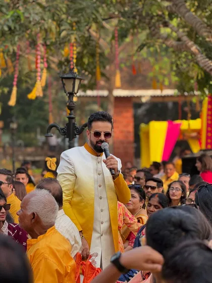 A candid shot while hosting the Haldi Hungama. The beautiful outdoor setting in Alibag was the perfect backdrop for a day of fun.