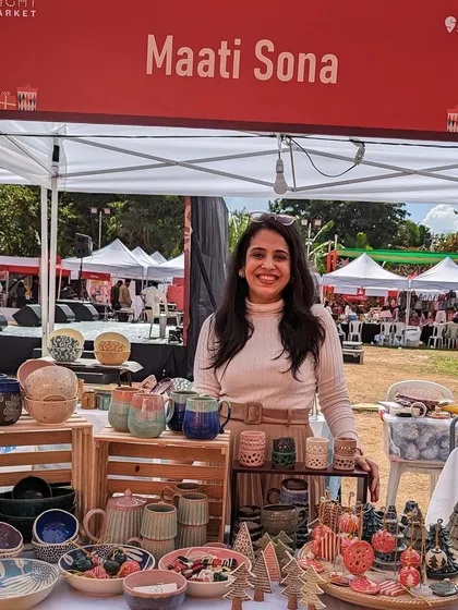 Here I am at a local market, surrounded by my creations. Meeting you in person and sharing the stories behind each piece is one of the most rewarding parts of my journey with Maati Sona.