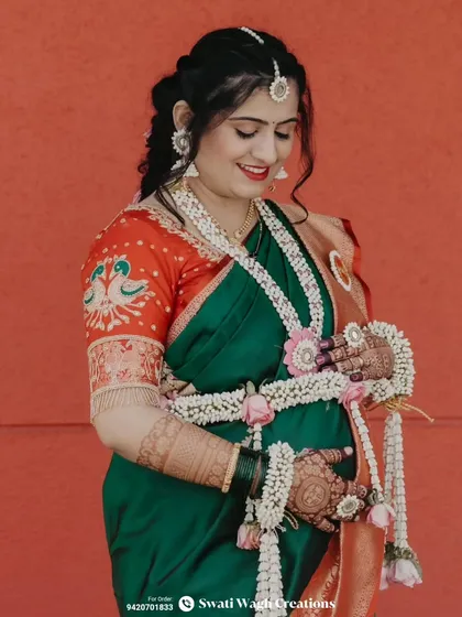 The beautiful details of the bride's embroidered blouse and our matching floral jewellery make for a stunning combination.