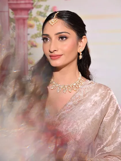 Another angle of this beautiful portfolio look, showcasing the soft waves and delicate jewelry styling that complements the makeup.