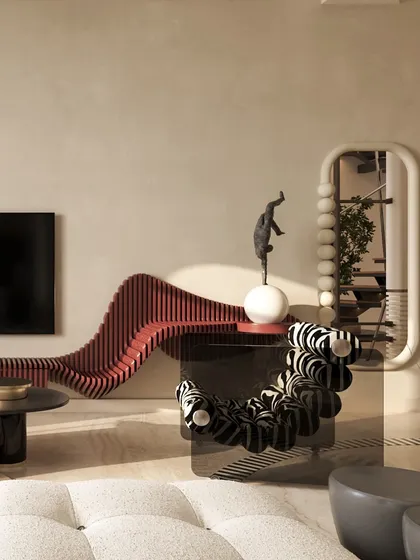 A closer look at the sculptural furniture that defines this living room. The zebra-print chair and undulating red console are not just functional; they are art pieces that inject energy and playful contrast into the home.