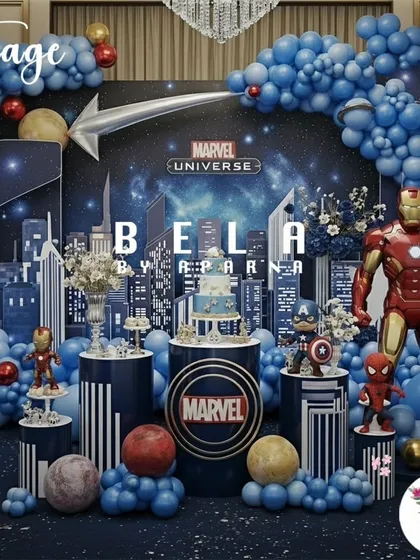 To show my range, I've included this epic Marvel Universe stage setup. It demonstrates how I can switch from soft and whimsical to bold and action-packed, using dynamic lighting, character props, and a cityscape backdrop to create a superhero's dream party.