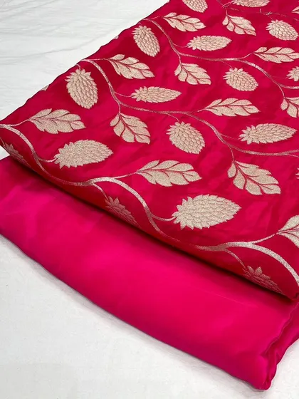 A vibrant rani pink designer crepe jacquard fabric, perfect for making a statement piece.