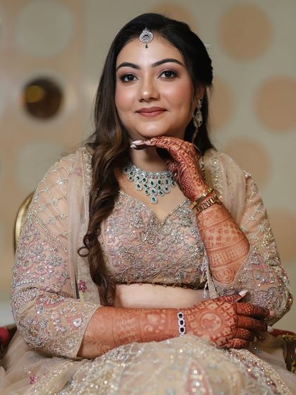 A portrait shot showcasing the complete engagement glam. The makeup, hair, and jewelry all work together to create a picture-perfect moment.