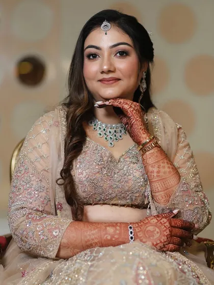 A portrait shot showcasing the complete engagement glam. The makeup, hair, and jewelry all work together to create a picture-perfect moment.