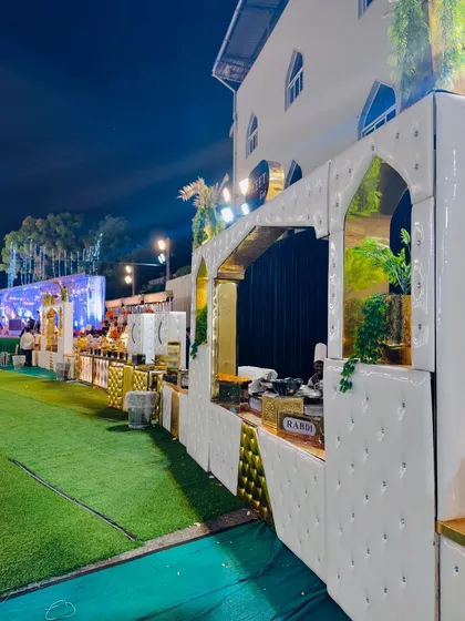 A full view of the white arched counters, a clean and modern setup for any wedding theme.