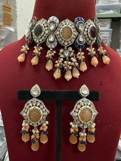 A multi-color version of my customizable choker, featuring peach, blue, and red stones. This rental is perfect for a colorful outfit.