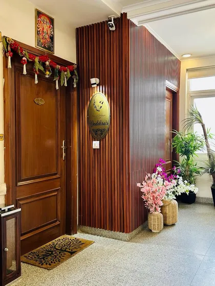 Another shot of the welcoming entryway, showing the arrangement of decorative elements like the lantern and doormat that complete the look.