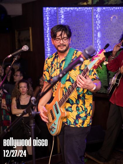 The bassist from The Kominas, adding a funky groove to our Bolliday Edition. Incorporating live bands is part of how I produce a unique, high-production-value event.