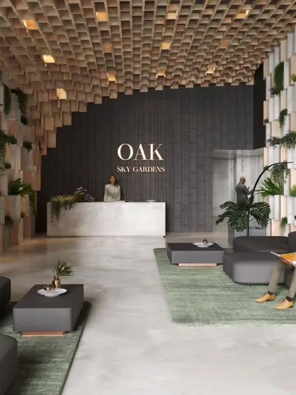 The entrance lobby at Sky Gardens features a dramatic ceiling of suspended wooden blocks and walls with integrated planters, immediately immersing visitors in the project's green ethos.