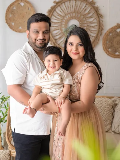 A classic family-of-three portrait. Everyone's happy smiles make this a perfect photo to display in the home.