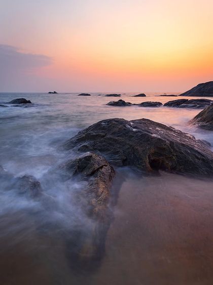 A long exposure captures the calm waters around the rocks after sunset. My post-processing work in Lightroom and Photoshop helped bring back the colors and mood I experienced at the scene.