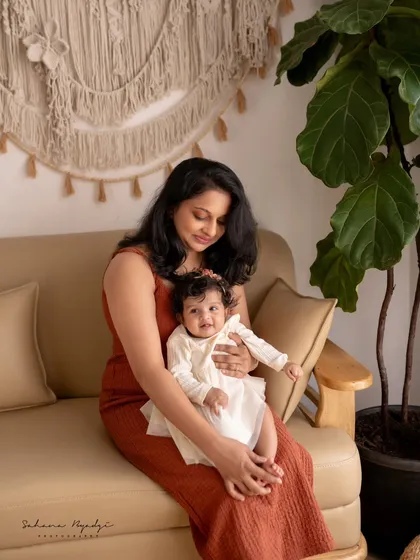 A sweet moment between mother and child in our cozy studio. The warm tones and soft lighting create a lovely, intimate feel.