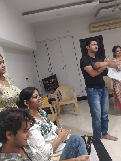 A group of students listening intently during a workshop session. We maintain a focused and disciplined environment for learning.
