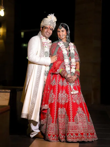 The quintessential wedding photo, capturing the couple in their full wedding attire. A beautiful memory of the day you said "I do."