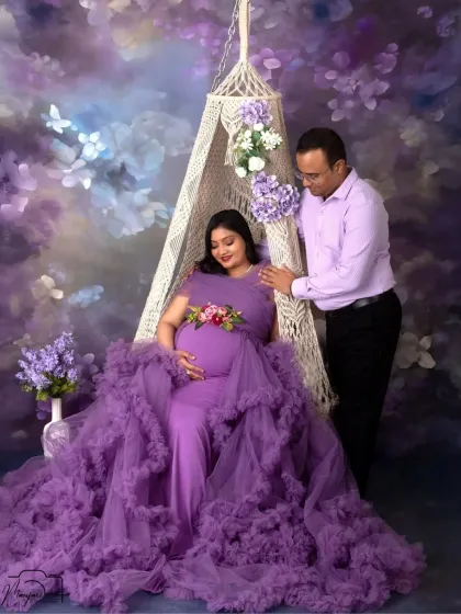 The full view of our purple floral swing setup, showcasing the beautiful ruffled gown and the dreamy, romantic atmosphere we create in the studio.