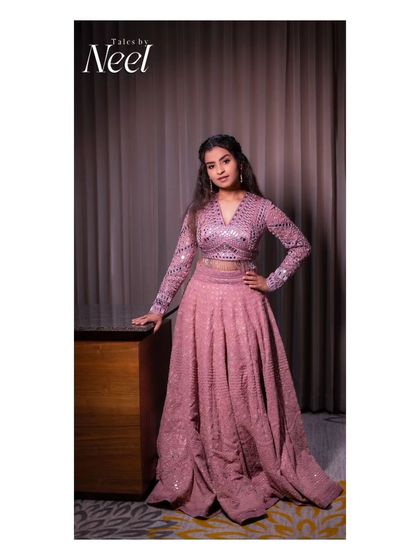 A full-length portrait of Sivaangi, showcasing her complete look for the concert. The modern hairstyle and glamorous lehenga are perfect for a stage performance.