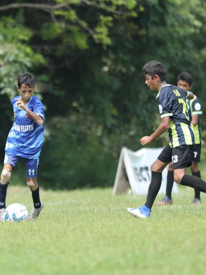 Dribbling in motion. Aryansh Bose glides past an opponent, showcasing the speed and control we emphasize in our training.