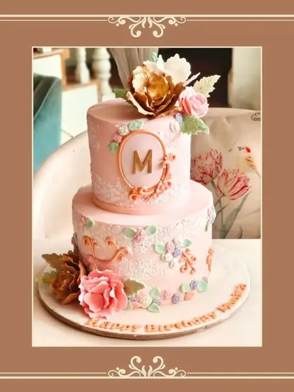 A beautifully photographed vintage pink cake with delicate lace piping and floral details.