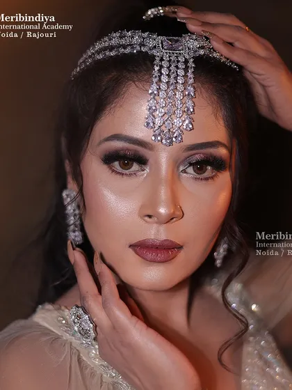 This engagement look is all about glamour, with dramatic eyes and diamond jewelry. I teach how to create a look that is special but distinct from the main wedding day makeup.