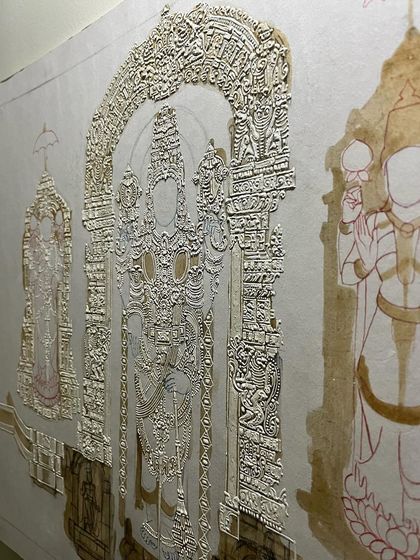 This is how the intricate gesso work looks under a spotlight. The raised details create a stunning 3D effect that will later be covered in gold leaf.