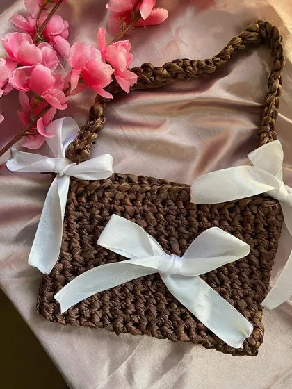 Top-down view of the brown crochet ribbon bag. It's a simple, rectangular shape that holds more than you'd think.
