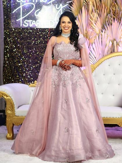 A full-length view of the lilac gown, showing its beautiful flare and elegant drape. This is a perfect example of the modern, stylish pieces we have for rent.