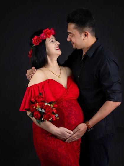 A joyful and candid moment between a couple. Their shared laughter makes this a heartwarming and authentic portrait.