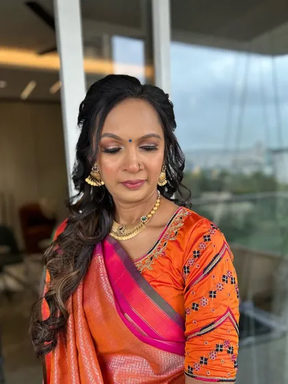 Eyes closed, you can see the delicate shimmer and blending work on the eyelids. This soft brown and gold eyeshadow look is universally flattering.