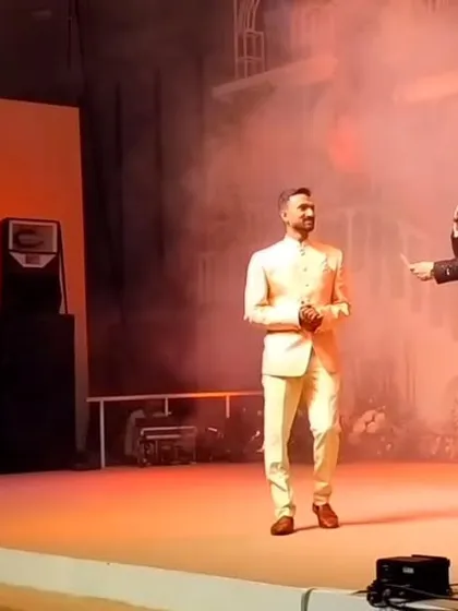 Sharing the stage with Manish Paul, one of India's top hosts, was a truly golden moment. I was performing a live sand art and glitter painting show for a grand engagement ceremony at the Jio World Convention Center in Mumbai.