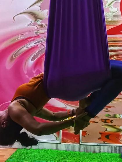 We learn to fly not by being fearless, but by the daily practice of courage. This deep forward bend in the hammock is a perfect example of that.