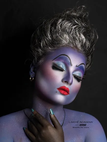 The closed-eye shot of the Ursula makeup, focusing on the sharp, villainous brows and the expertly blended eyeshadow. This demonstrates the technical skill required for high-concept character creation.