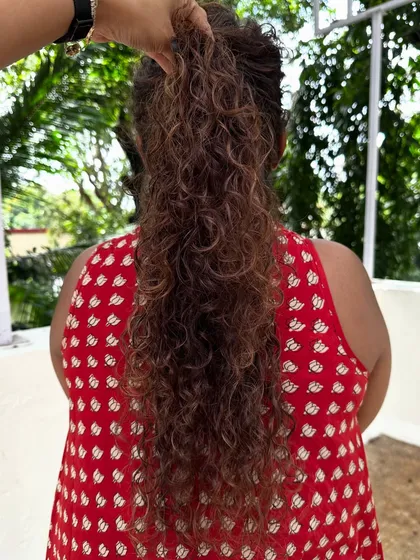 Once you embrace your curls, you never go back. For her new job, we did a haircut to reshape her curls and added highlights to make them stand out.