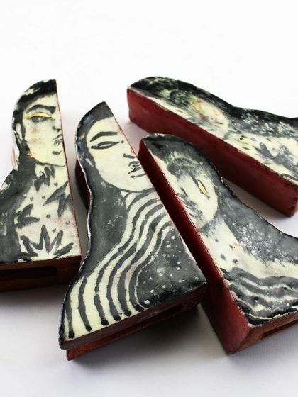 Small, individual ceramic components from the 'Confrontation' series.