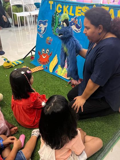 Interacting with the children one-on-one with my puppets is a key part of the experience. It helps even the shyest kids open up and join in the fun.