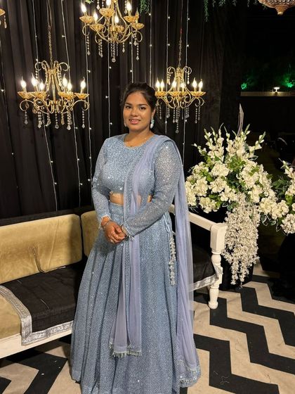 A closer look at the sequin work on this blue sangeet lehenga. The detailed craftsmanship on the blouse and skirt ensures you sparkle from every angle.